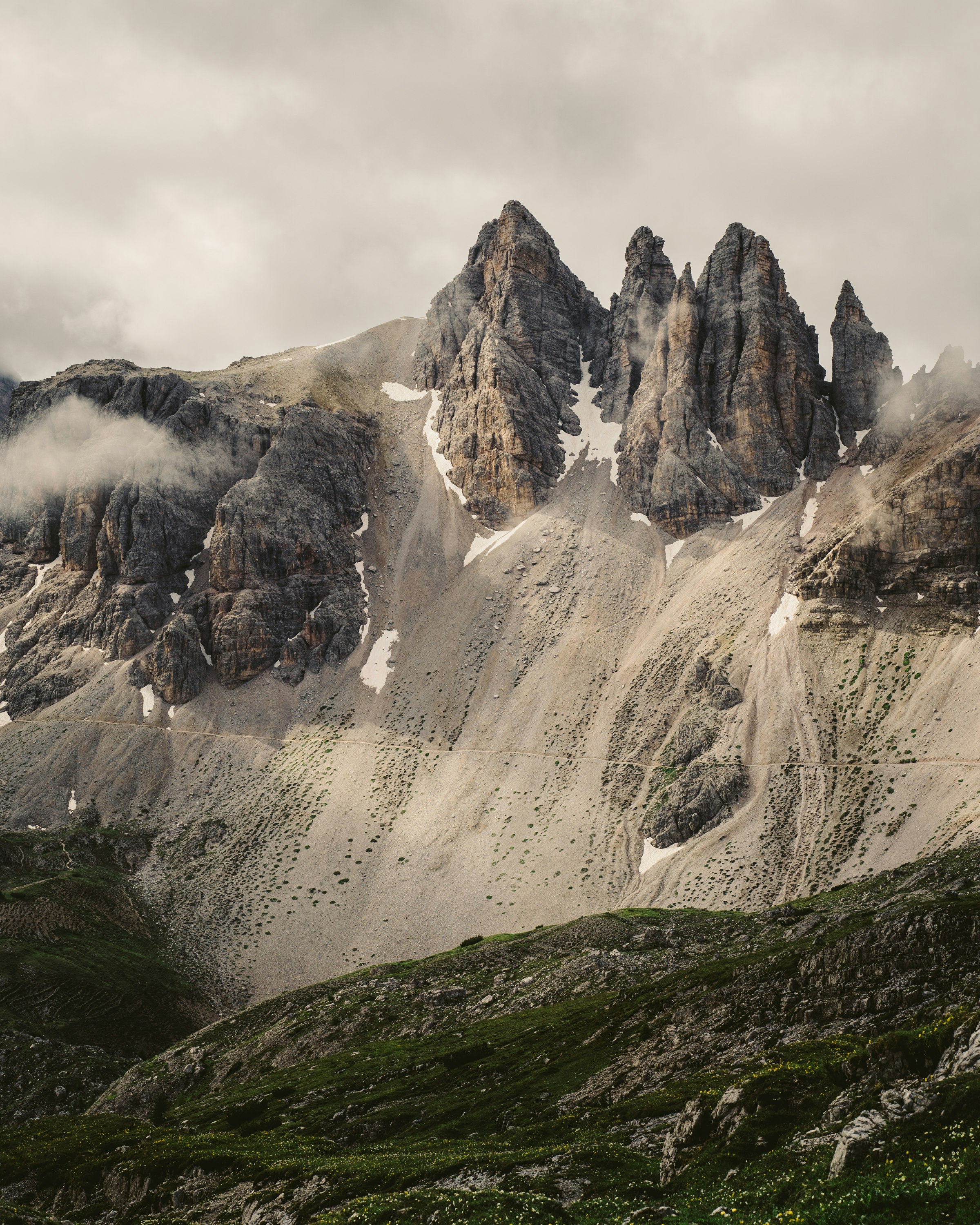 green grass covered mountain during daytime